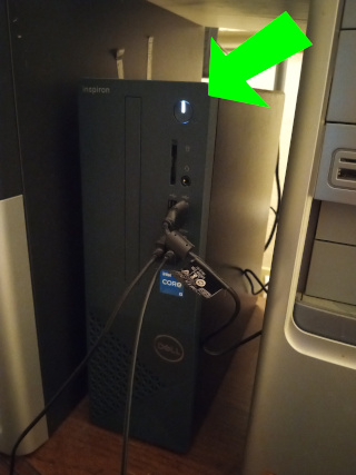 Image of a tower PC with the power light on